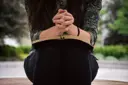 Woman praying with closed eyes in peaceful meditation